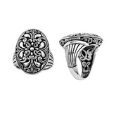 Handcrafted sterling silver oval floral ring with Balinese scroll detailing and oxidized finish, elegant artisan statement jewelry.